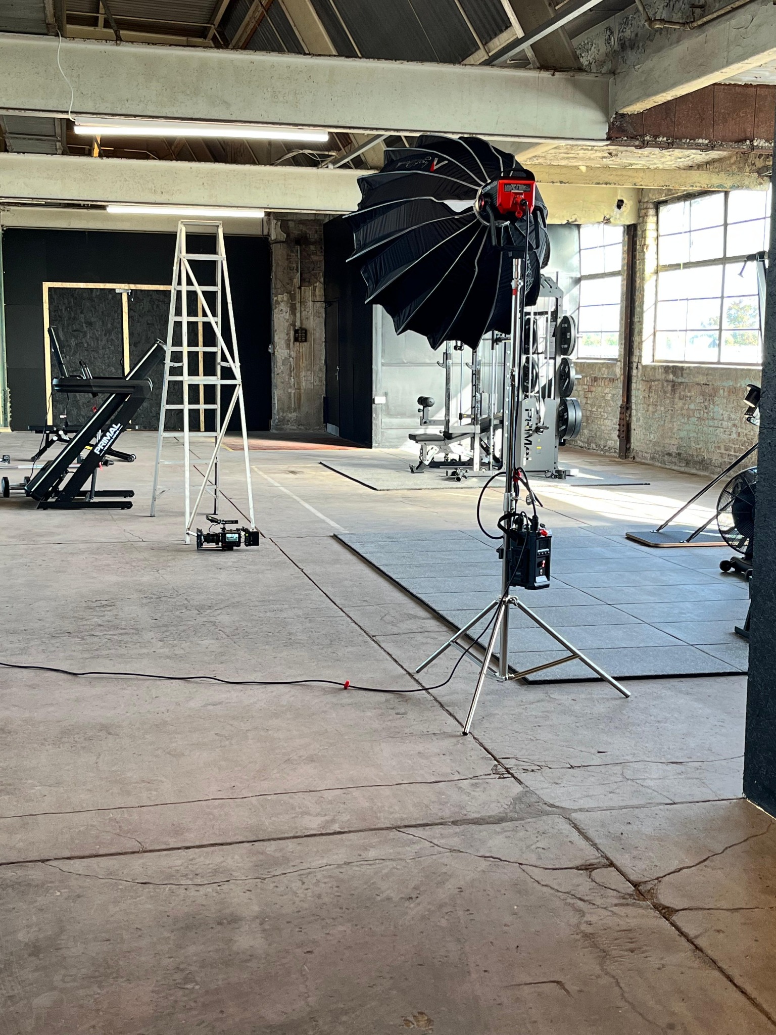 Lighting and camera equipment set up on the studio floor